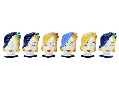 Lot 267 - Six Beswick Art Deco mask head ceramic napkin rings.