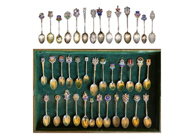 Lot 204 - An impressive collection of British silver and enamel souvenir teaspoons.