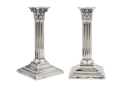 Lot 271 - A pair of Edwardian Corinthian column silver candlesticks by James Deakin & Sons.