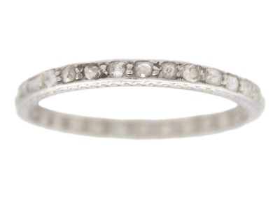 Lot 78 - An early 20th century platinum diamond set full eternity ring.