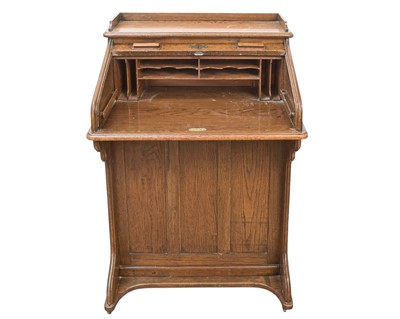 Lot 461 - An oak narrow roll top desk.