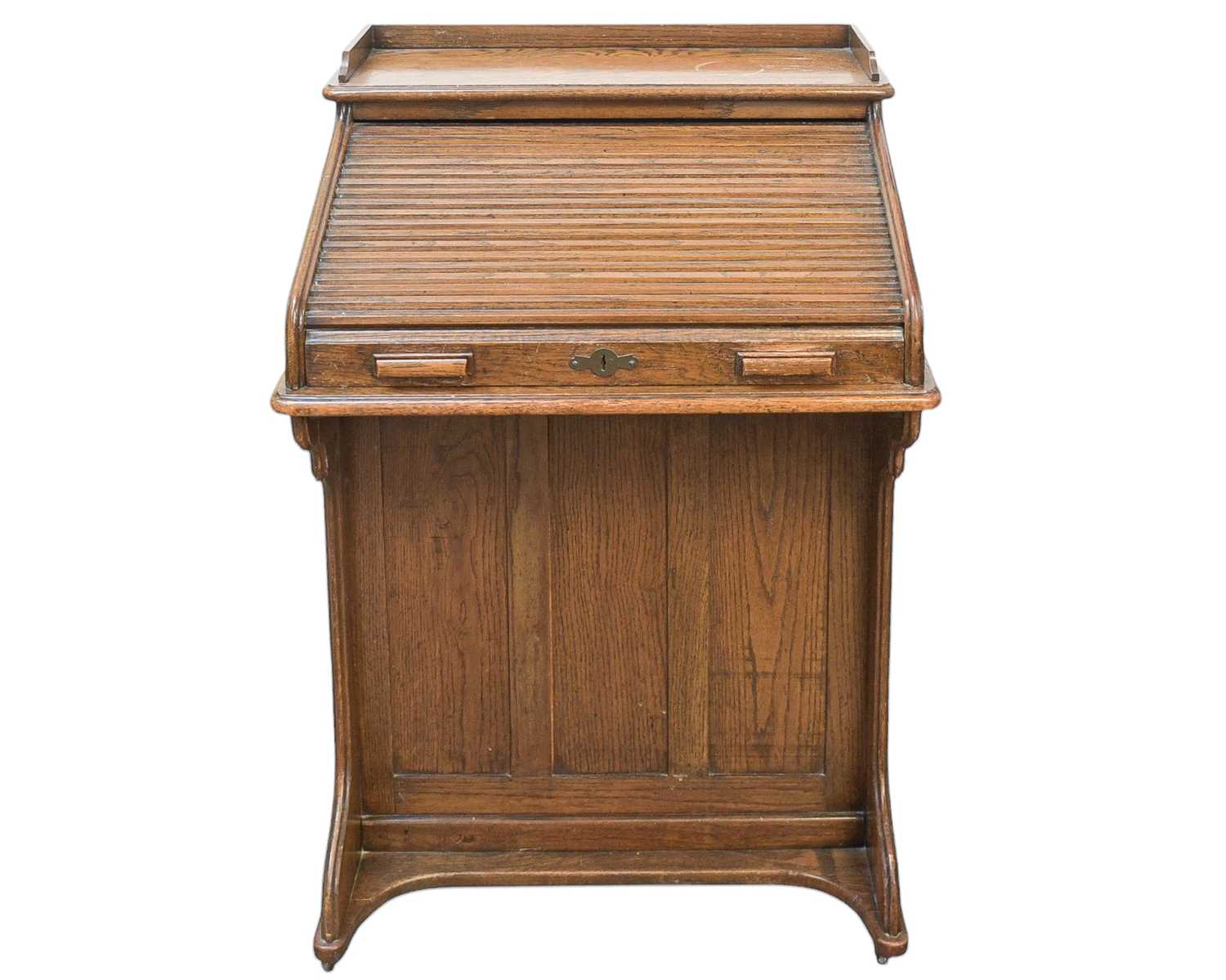 Lot 461 - An oak narrow roll top desk.