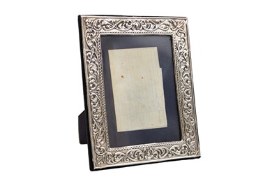 Lot 285 - A pair of modern Victorian-style silver-mounted photo frames.