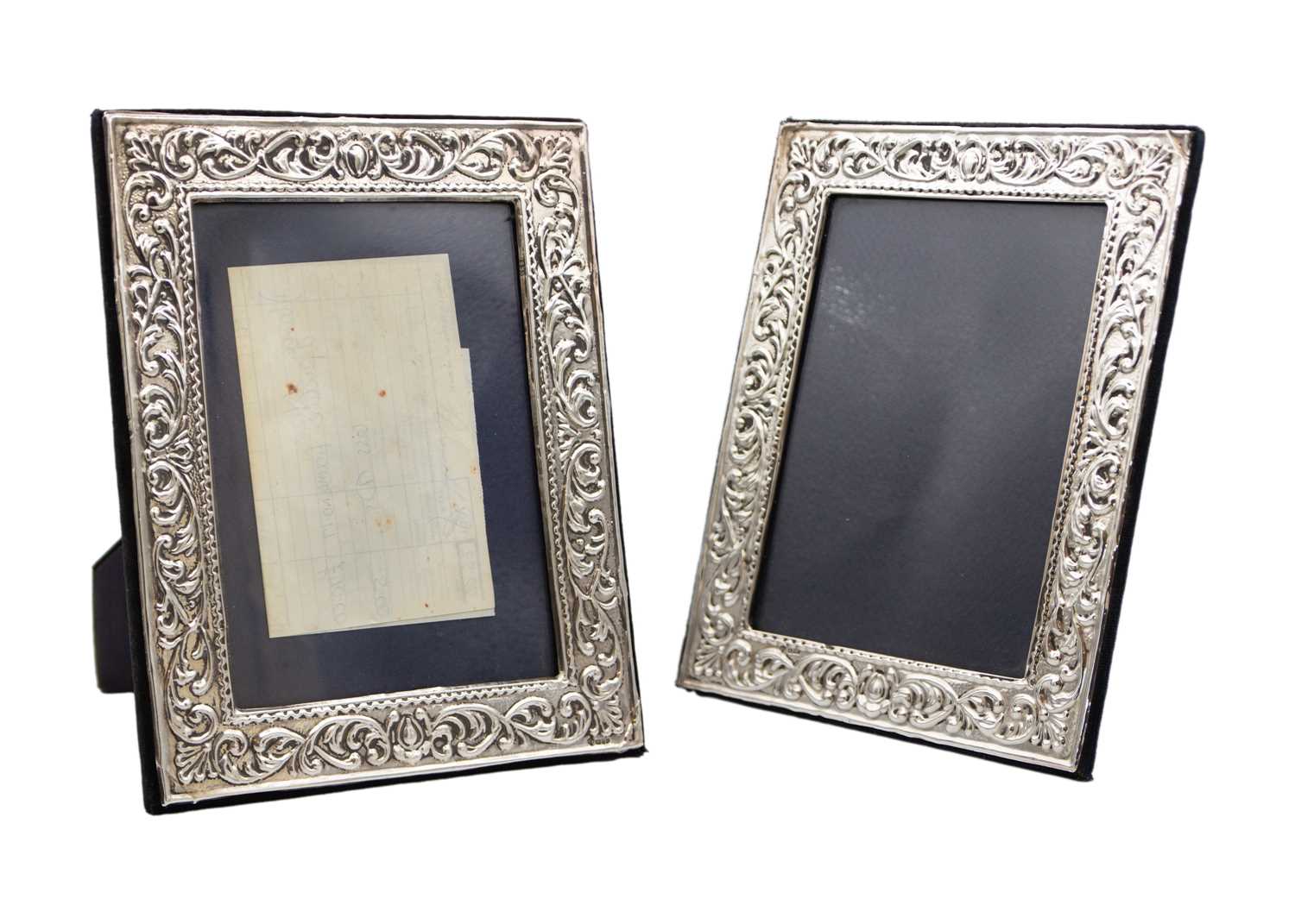 Lot 285 - A pair of modern Victorian-style silver-mounted photo frames.