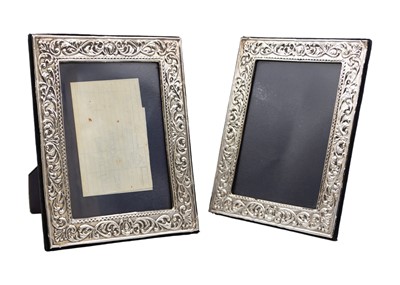 Lot 285 - A pair of modern Victorian-style silver-mounted photo frames.