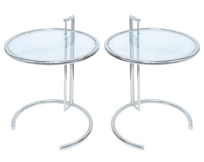 Lot 260 - A pair of chrome and glass E1027 tables, after Eileen Gray.