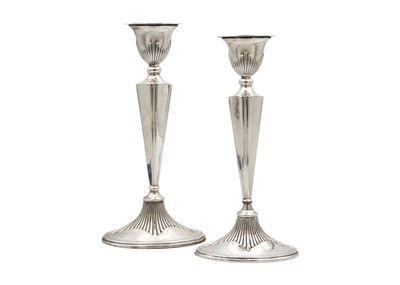 Lot 293 - A pair of George V silver Adam-style candlesticks.