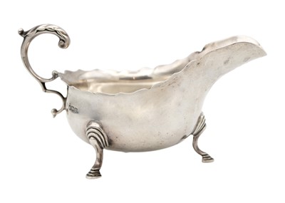 Lot 294 - A George V silver gravy boat by Thomas Bradbury & Sons.