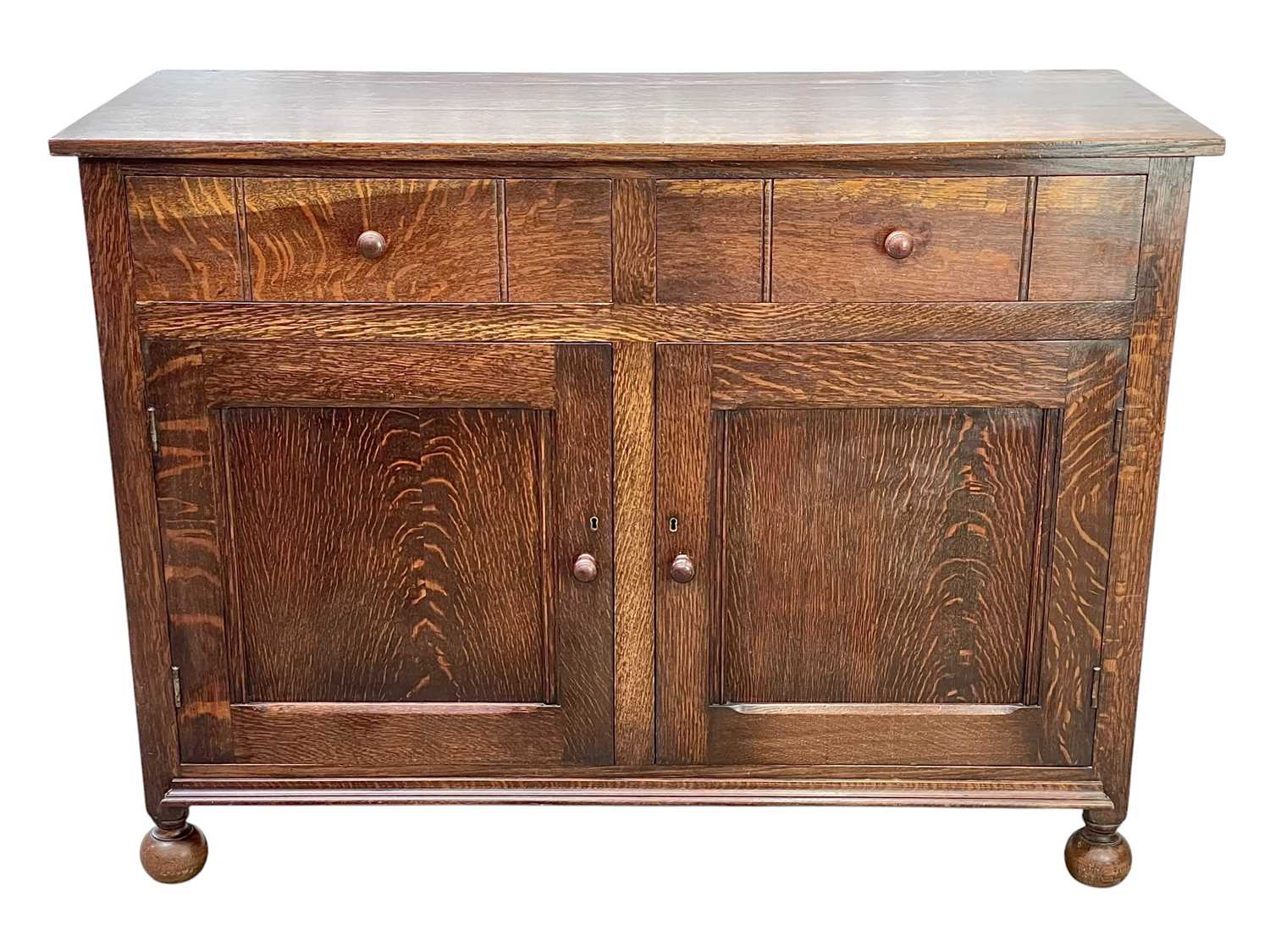 Lot 241 - A Heal's oak sideboard.