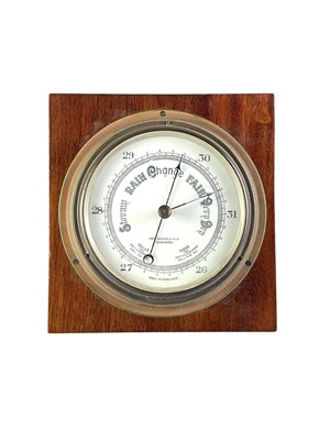 Lot 149 - A brass aneroid circular barometer.