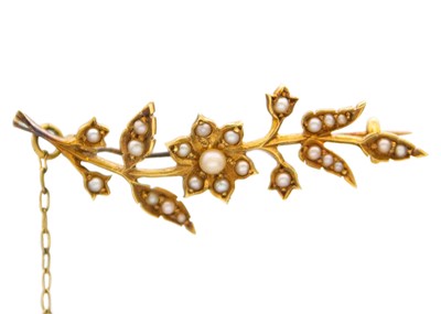 Lot 174 - A 15k seed pearl set floral brooch.