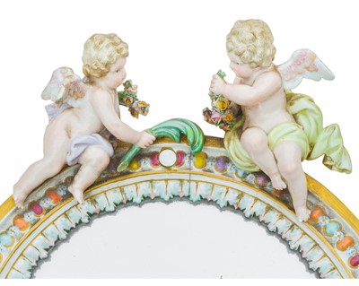 Lot 202 - A Meissen oval porcelain easel mirror.