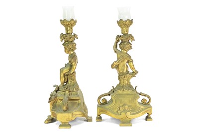 Lot 376 - A French ormolu clock garniture.