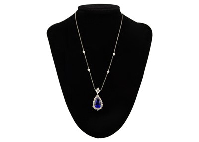 Lot 111 - An impressive pear-shaped Tanzanite pendant necklace in 18K white gold with diamonds.