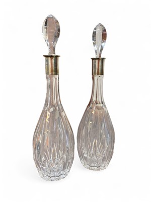 Lot 188 - A pair of German white metal mounted lead crystal decanters and stoppers.