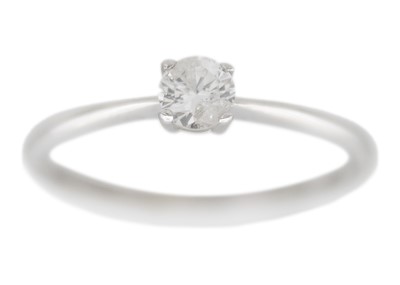 Lot 170 - A 9k white gold diamond solitaire ring.