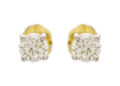 Lot 171 - A pair of 18k round brilliant-cut diamond solitaire ear studs.