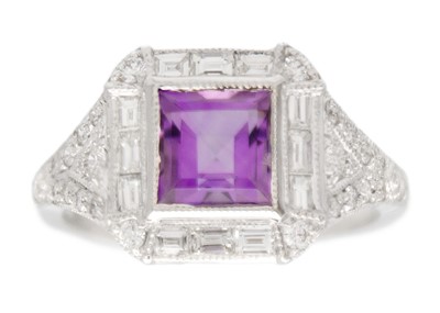 Lot 205 - An 18k white gold Art Deco style amethyst and diamond set dress ring.