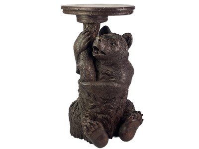 Lot 1 - A Black Forest Linden wood carved bear stand.