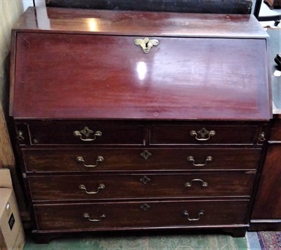 Lot 3424 - A George III mahogany bureau, the fall front...