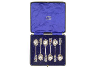 Lot 37 - A cased set of six Dutch .835 silver and enamel souvenir spoons.