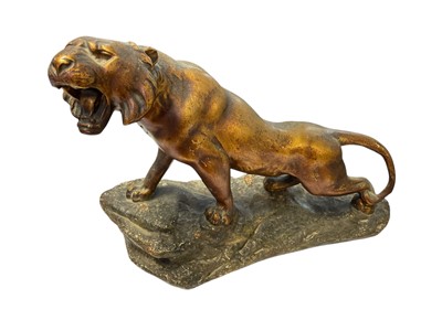 Lot 277 - A gilded plaster model of a roaring lion.