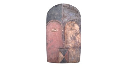 Lot 56 - A carved wood African mask.