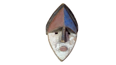 Lot 85 - A polychrome African mask.