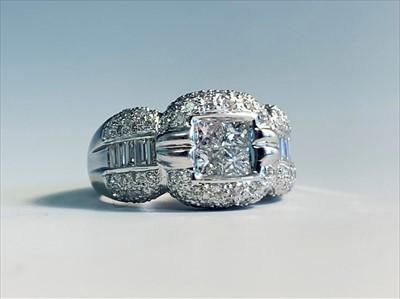 Lot 2557 - An 18 white gold diamond set ring in 1950's...