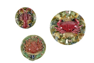 Lot 196 - Three Palissy Ware type circular wall plates.