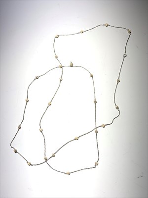 Lot 2531 - A platinum and pearl long chain 120cm