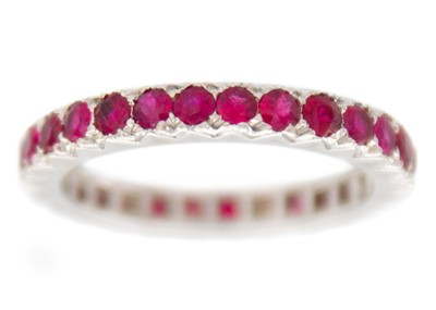 Lot 106 - A French full eternity ruby band ring in 18k white gold.