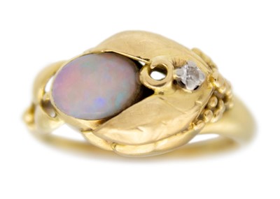 Lot 141 - An 18k gold opal and diamond set dress ring.