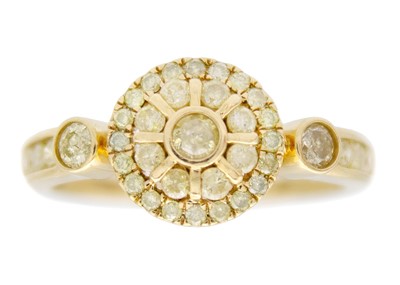 Lot 128 - A 9k gold yellow diamond cluster ring.