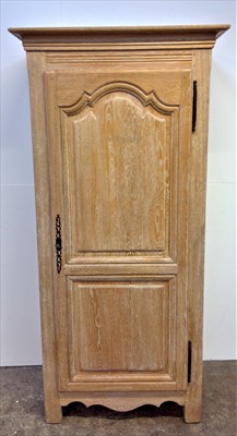 Lot 3486 - A limed oak single armoire by Christian...