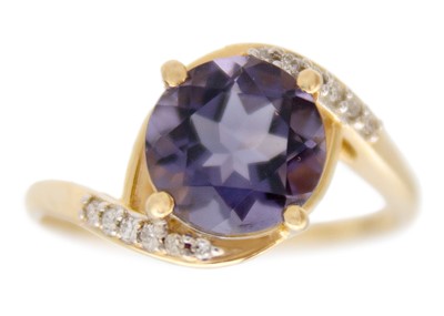 Lot 125 - A 9k gold blueberry quartz and diamond crossover ring.