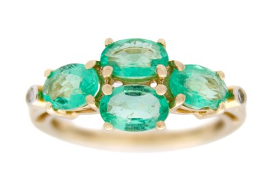 Lot 127 - A 9k gold emerald and diamond ring.