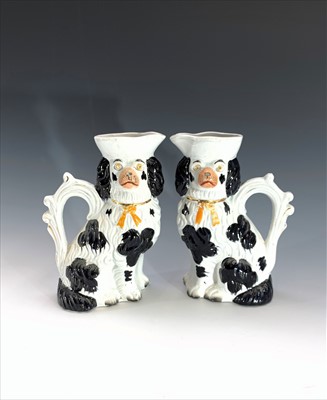 Lot 1037 - A pair of Victorian Staffordshire jugs...