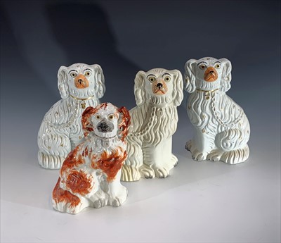 Lot 1038 - A pair of Victorian Staffordshire dogs, height...