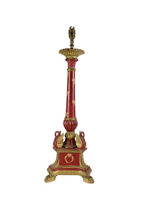 Lot 325 - A carved wooden gilt and red painted table lamp.