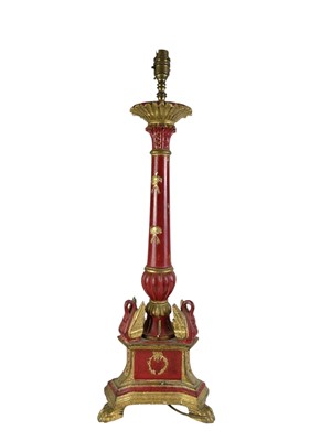 Lot 325 - A carved wooden gilt and red painted table lamp.