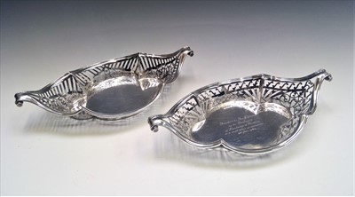 Lot 2010 - Two similar pierced silver, shaped baskets...