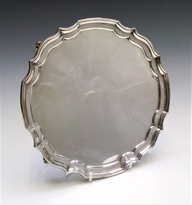 Lot 2012 - A post war shaped silver tray on four scrolled...