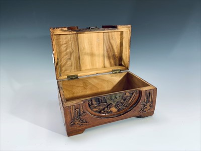 Lot 715 - A Chinese carved camphor wood miniature chest,...