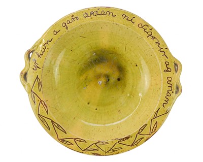 Lot 223 - A late 19th century Ewenny slipware pottery two handled dish.