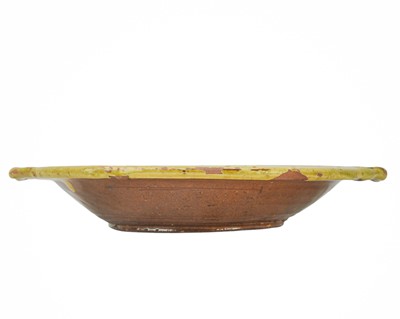 Lot 223 - A late 19th century Ewenny slipware pottery two handled dish.