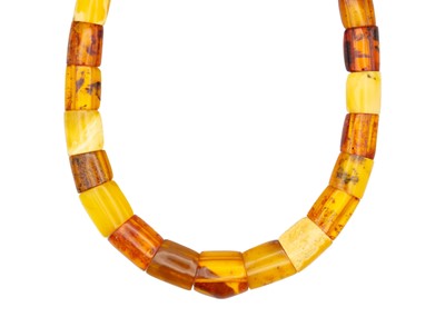 Lot 163 - A contemporary multi-coloured amber panel bead choker necklace with gold plated button clasp.