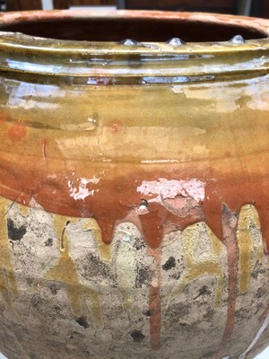Lot 240 - A large terracotta olive jar with three loop...