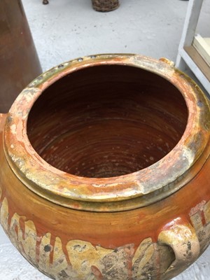 Lot 240 - A large terracotta olive jar with three loop...