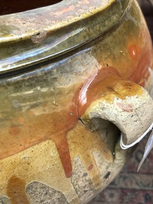 Lot 240 - A large terracotta olive jar with three loop...